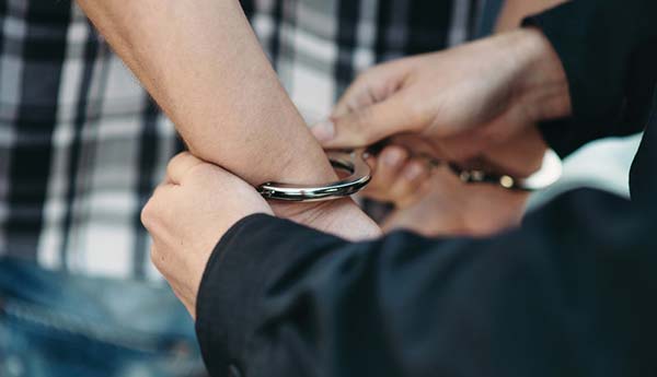 Person being Hand Cuffed